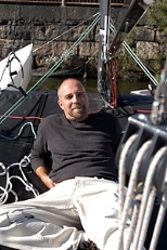 Bob Toabe, a jazz pianist and deck hand at the MIT Sailing Pavillion, relaxes on the Charles River. Toabe will perform today (Oct. 8) in Killian Hall.