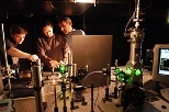 Postdoctoral associate Preston Snee, graduate student Aetna Wun and Professor Daniel G. Nocera (left to right) use a laser microsensor.