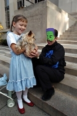 Sgt. Cheryl Vossmer (right) of the MIT Police, a.k.a. the Incredible Hulk, was one of many Community Giving campaign volunteers who got dressed up on Halloween to hand out candy and spread the word about the campaign's kickoff. In a bit of serendipity, Isabelle Harris, dressed as Dorothy from "The Wizard of Oz," cradled Vossmer's dog Sophie--who bears a striking resemblance to Toto. Isabelle's fat...