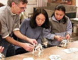 George Hart works on patterns for the "Salamanders" sculpture with graduate students Wai Ling Yee and Fumei Lam.