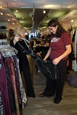 Betsy Jenney (left) shows Rayna Zacks some dresses at her Newbury Street boutique.