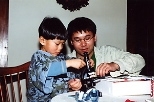 Dillon Tavitian (left) and his big sibling David Nguyen do some exploring together with a microscope Nguyen gave Dillon.