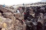 The class does some climbing at California's Fossil Falls, the remains of a waterfall carved by the Owens River thousands of years ago. Students found obsidian chips and places in the rock where women once ground grain at a Native American settlement on the river bank.