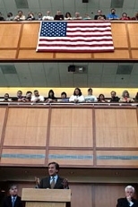 Lincoln Laboratory employees gaze down as U.S. Rep. John Tierney, flanked by Rep. Marty Meehan, left, and U.S. Sen. Edward Kennedy, speaks at a panel highlighting the regional collaboration between academic, military and private sectors.