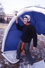 Griffith stands inside one of his inventions, an inflatable kite for kite-surfing and other wind-powered sports.