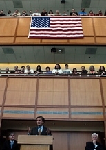 Lincoln Lab employees gaze down as U.S. Rep. John Tierney (center), flanked by Rep. Marty Meehan (left) and U.S. Sen. Edward Kennedy, speaks at a panel highlighting the regional collaboration between the academic, military and private sectors.