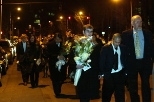 Mourners walk in a procession to the center of the Harvard Bridge where they tossed flowers into the Charles River following the memorial service for Daniel Mun. Right to left: Robert Randolph, senior associate dean for students; Thomas Mun, Daniel's brother; Lowery Duvall, a junior in aeronautics and astronautics and Chi Phi fraternity member; Dr. Andy Mun, Daniel's father.