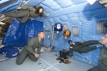 The SPHERES team tested the mini satellites last month aboard NASA's KC-135 airplane used to simulate weightlessness for brief periods. Left to right: team members Stephanie Chen (near ceiling), Steve Sell and Edmund Kong, and Gary Blackwood of NASA's Jet Propulsion Laboratory.