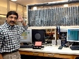 Professor Anant Agarwal, associate director of CSAIL, demonstrates another piece of Stata Center research: a 1,020-node microphone array utilizing the RAW tile parallel processor architecture for computation. The device is designed to make a clean recording of speech in computing environments characterized by much noise and crosstalk.
