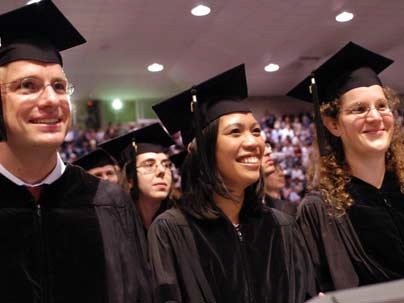 Doctoral degree students in biological engineering smiled, laughed and clapped their way through MIT's hooding ceremony Thursday. From left, Jan Lammerding, Janice Lansita and Katarina Midelfort.