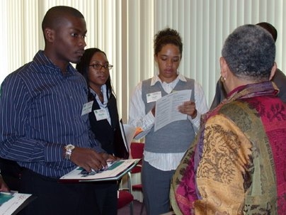 Left to right: Gille-Arnaud Bleu-Laine from Georgia Tech, Manelle Samuels from the University of Hartford and Shani Matthews from Spelman College speak to Ayida Mthembu, associate dean of counseling and support services, during an information session during the graduate student recruiting weekend, Converge.