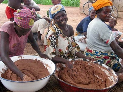Ghanaian women making shea butter.