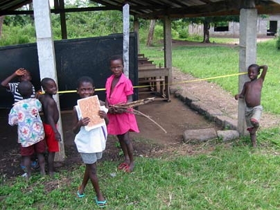 The ENGhana team helped teach children about measurement while documenting the dimensions of a temporary school in a Ghanaian village.