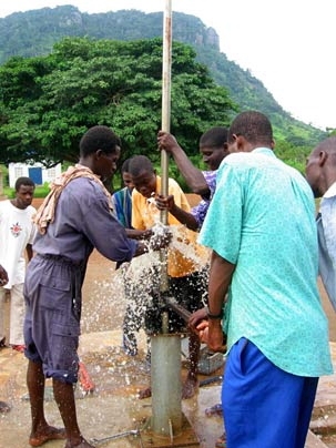 Ghanaians bore for water.
