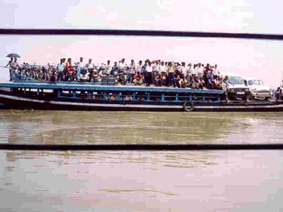 Overcrowded ferry in India.