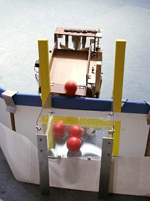 The fifth ball is still halfway up the Archimedes screw when this picture was taken. "We knew it took a little over 20 seconds to lift a ball up, so we programmed the robot to remember the last time it picked up a ball and not leave the goal until 30 seconds after this time, if it docked early," said team member Andrew Spann. "The robot docked with about a minute of time remaining, then waited unt...