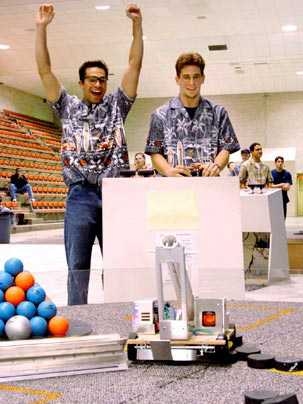 Dean Ljubicic, right, scores the winning shot in the 2004 contest, 'The Big Dig.' Co-driver Salvatore Pallante, left, leads a victory cheer.
