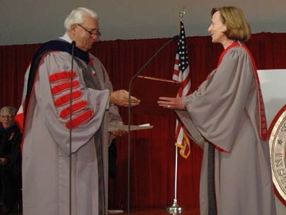 At her inauguration as 16th president of MIT, Susan Hockfield accepts the university charter from Dana Mead, chairman of the MIT Corporation.