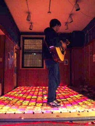Mike Anderson takes a mid-construction break on the dance floor before the plastic surface is installed.