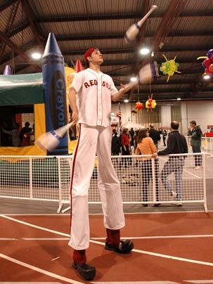 Alumnus Jake Abernethy (S.B. 2002) portrays a very tall Red Sox juggler at MIT's May 7 block party.