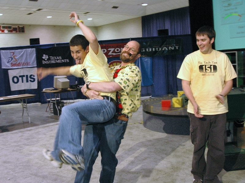 Mark Cote, winner of this year's 2.007 robot competition, gets a congratulatory hug from Professor Alexander Slocum.