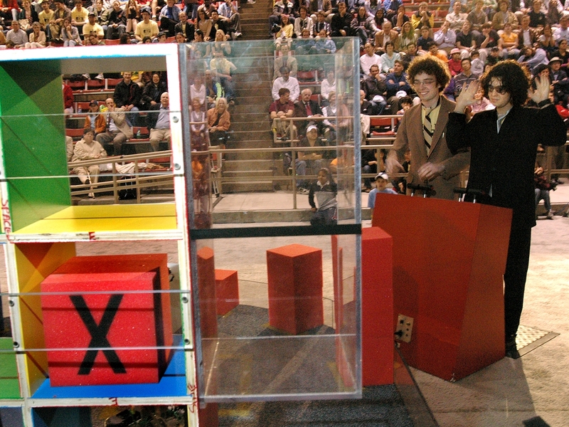 Jesse Marsh, left, and Aron Zingman, right, drive into the final rounds of 2.007 on Friday night in the Johnson Athletics Center. Marsh won seventh place.