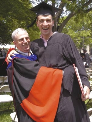 Professor John Guttag proves he can still pick up his "little boy," giving David Guttag a lift shortly after he graduated Friday, June 3.