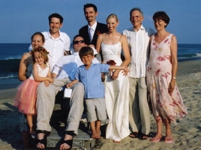 The Heywoods gather together for a family wedding in July 2004. Stephen is in the wheelchair with his brothers behind him: Jamie is at left; Benjamin is at center. Their parents, Professor John and Peggy Heywood, are at the far right. The bride is Benjamin's wife, Sherie. Stephen's wife, Wendy, is at the far left behind Jamie's daughter, Zoe. Stephen's son, Alex, is in front.