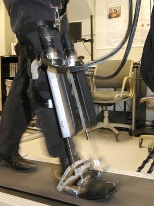 Hermano Igo Krebs, a principal research scientist in MIT's mechanical engineering department, takes the Anklebot for a test walk on a treadmill June 24 at MIT's Newman Laboratory for Biomechanics and Human Rehabilitation.