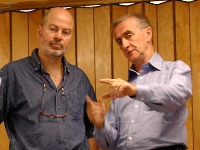MIT research scientist Hermano Igo Krebs, left, consults with MIT Professor Neville Hogan during a test of the new Anklebot June 24 at MIT's Newman Laboratory for Biomechanics and Human Rehabilitation.