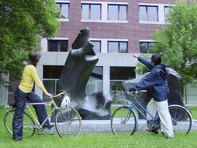 List Visual Arts Center Education and Outreach Coordinator Hiroko Kikuchi, right, points out the elements of Henry Moore's Reclining Figure at MIT to Anna Lovecchio last week. Kikuchi will be one of the leaders of the Art on Wheels campus tour on Wednesday, July 13.