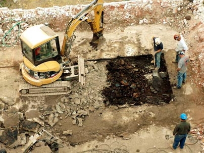 It's out with the old to make way for the new as construction workers labor away on the PDSI project Monday.