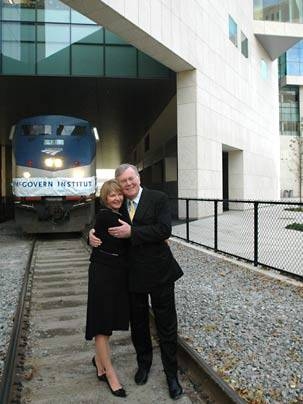 Lore Harp McGovern and Pat McGovern hug on the tracks that run under the brain and cognitive sciences complex, new home of the McGovern Institute for Brain Research at MIT. <a onclick="MM_openBrWindow('mcgovern-tracks-enlarged.html','','width=509, height=583')">
<span onmouseover="this.className='cursorChange';">Open image gallery</span>
</a>
<noscript> <a href="mcgovern-tracks-enlarged.html">
...