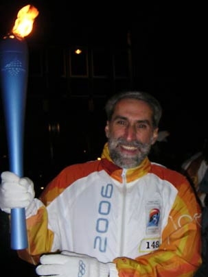 Daniel Nocera, MIT professor of chemistry, carries the Olympic torch through Rome on Dec. 8, 2005, the first day of its relay from Rome to the 2006 Olympics in Turin, Italy.