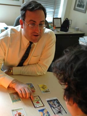 MIT Financial Aid Director Daniel Barkowitz lays out a few fool cards from different decks of tarot cards. Barkowitz teaches two courses during the Independent Activities Period -- one on financial aid and one on tarot.