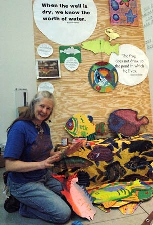 Artist-in-residence Cindy Snodgrass shows off some painted fish that are part of her temporary installation about water in the Stata Center. The exhibit is called 'S.O.S.-Fish.'