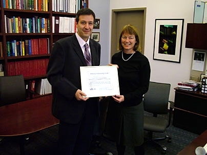 Assistant Professor Vladimir Stojanovic is congratulated on his Doherty Professorship by Alice Gast, vice president for research and associate provost.