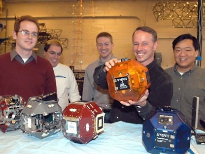 MIT aero/astro team members spent years building and testing these volleyball-sized satellites. The devices were launched April 24 to the International Space Station. Left to right: graduate students Dustin Berkovitz, Alvar Saenz-Otero and Mark Hilstad, Professor David Miller and research scientist Edmund Kong.