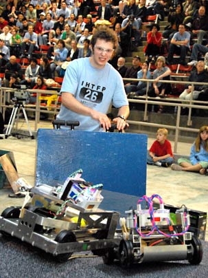 Second-place winner sophomore Orian Welling drives his machine towards the high-scoring 'A' bins as an opponent threatens gridlock.
