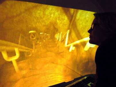 Elizabeth Goldring, a senior fellow at MIT's Center for Advanced Visual Studies, looks at an image she created to approximate what she sees when she looks through her seeing machine at an image of a staircase.