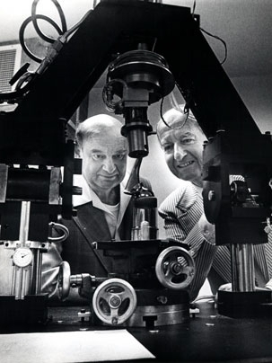 Professor Robert W. Mann, right, views an experiment in the MIT hip simulator with Soviet academician Victor Gurfinkel in the late 1970s.