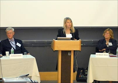 Professor Dava Newman, director of MIT's Technology and Policy
Program, makes introductory remarks at the program's 30th anniversary symposium, held June 8. TPP's founding director, Professor Richard de Neufville, and Institute Professor Sheila Widnall look on.