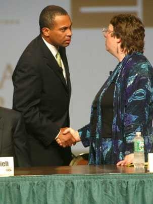 Massachusetts gubernatorial candidate Deval Patrick, a Democrat, shakes hands with Green-Rainbow Party candidate Grace Ross at MIT July 12 during a forum focused on environmental issues.