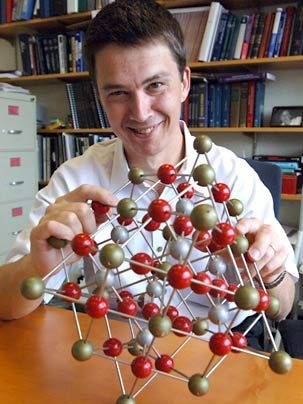 Professor Gerbrand Ceder holds up a model of a perovskite crystal. Ceder and his team of researchers have used data about such crystals to come up with a method for predicting the structure of materials.