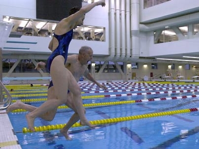 Barrie and Al Zesiger leap into one of two pools at the MIT fitness center that bears their names. The Al and Barrie Zesiger Sports and Fitness Center won a recent popular vote for 'Best Swimming Pool' in the Boston area.