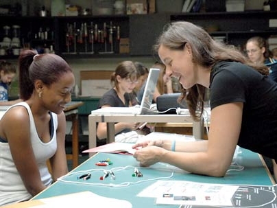 Sherianna of Hyde Park, Mass., works with Amy Fitzgerald
  of the Edgerton Center during the You Go Girl! program Aug. 2.