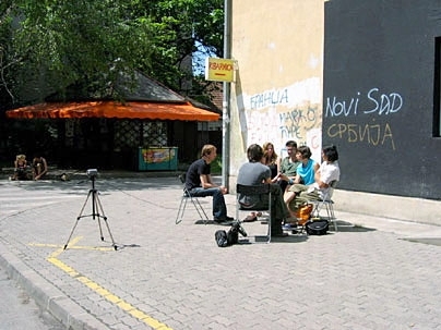 Architecture graduate student Azra Aksamija and organizers of the Lost Highway Expedition are interviewed by fellow travelers in front of Kuda.org in Novi Sad, Serbia.