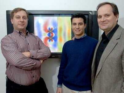 Researchers present a graphic illustrating how magnetism can transmit energy wirelessly. Marin Soljacic, left, assistant professor of physics, Aristeidis Karalis, G, and John Joannopoulos, professor of physics, use theoretical calculations and computer simulations to find ways to recharge electronics wirelessly.