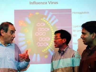 Professors Alexander Klibanov, left, Jianzhu Chen and MIT researcher Jayanta Haldar discuss the 'antimicrobial paint' they have developed.