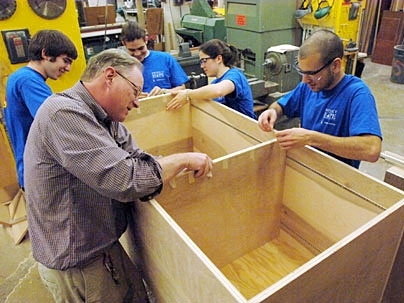 Members of the MIT Hobby Shop work on a storage unit for the Project Hope shelter in Boston. From left  to right are junior Ilan Moyer, Hobby Shop Director Kenneth Stone, junior Folkers Rojas, sophomore Alexis Dale and junior Dayan Paez.